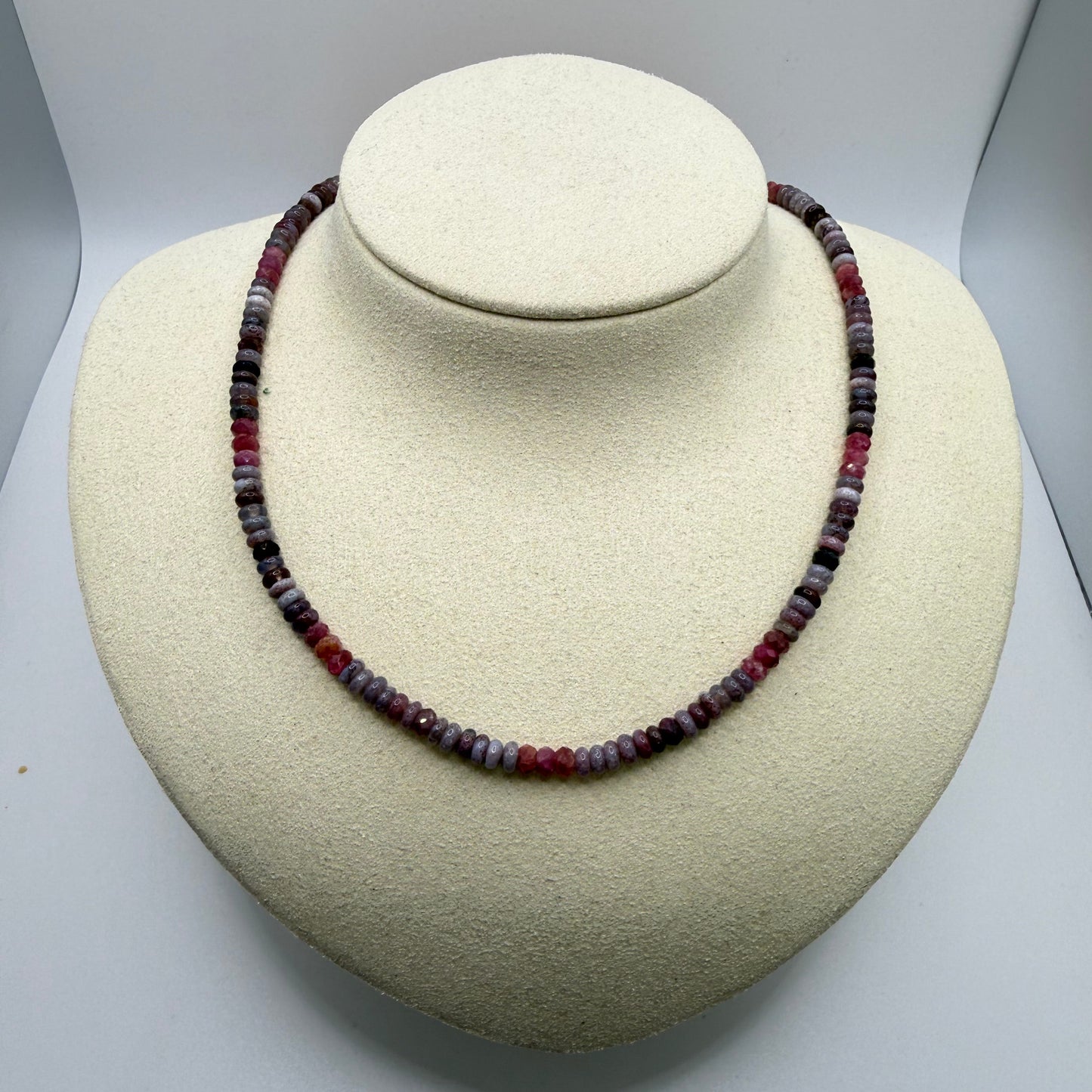 lilac and pink beaded necklace on a white display bust