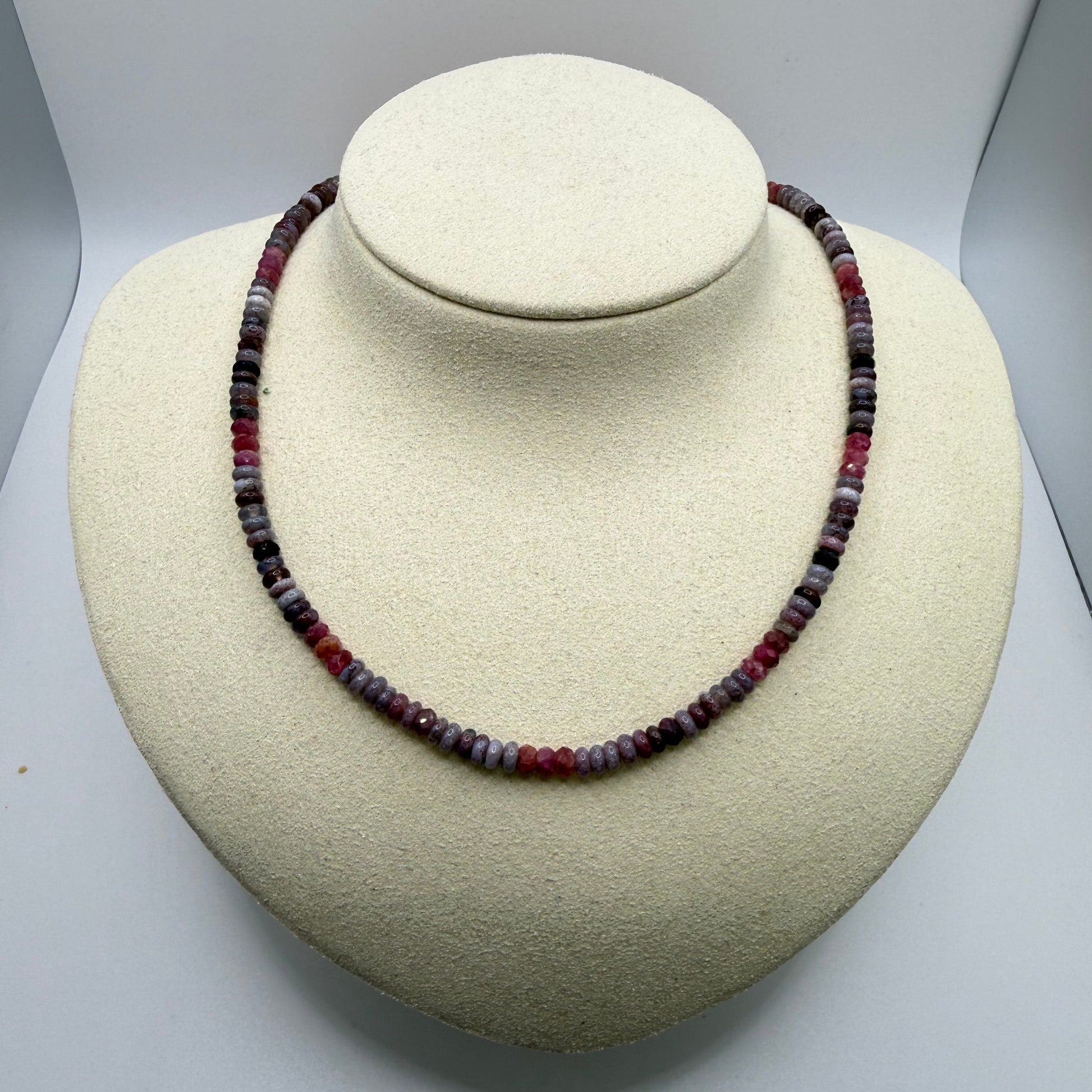 lilac and pink beaded necklace on a white display bust